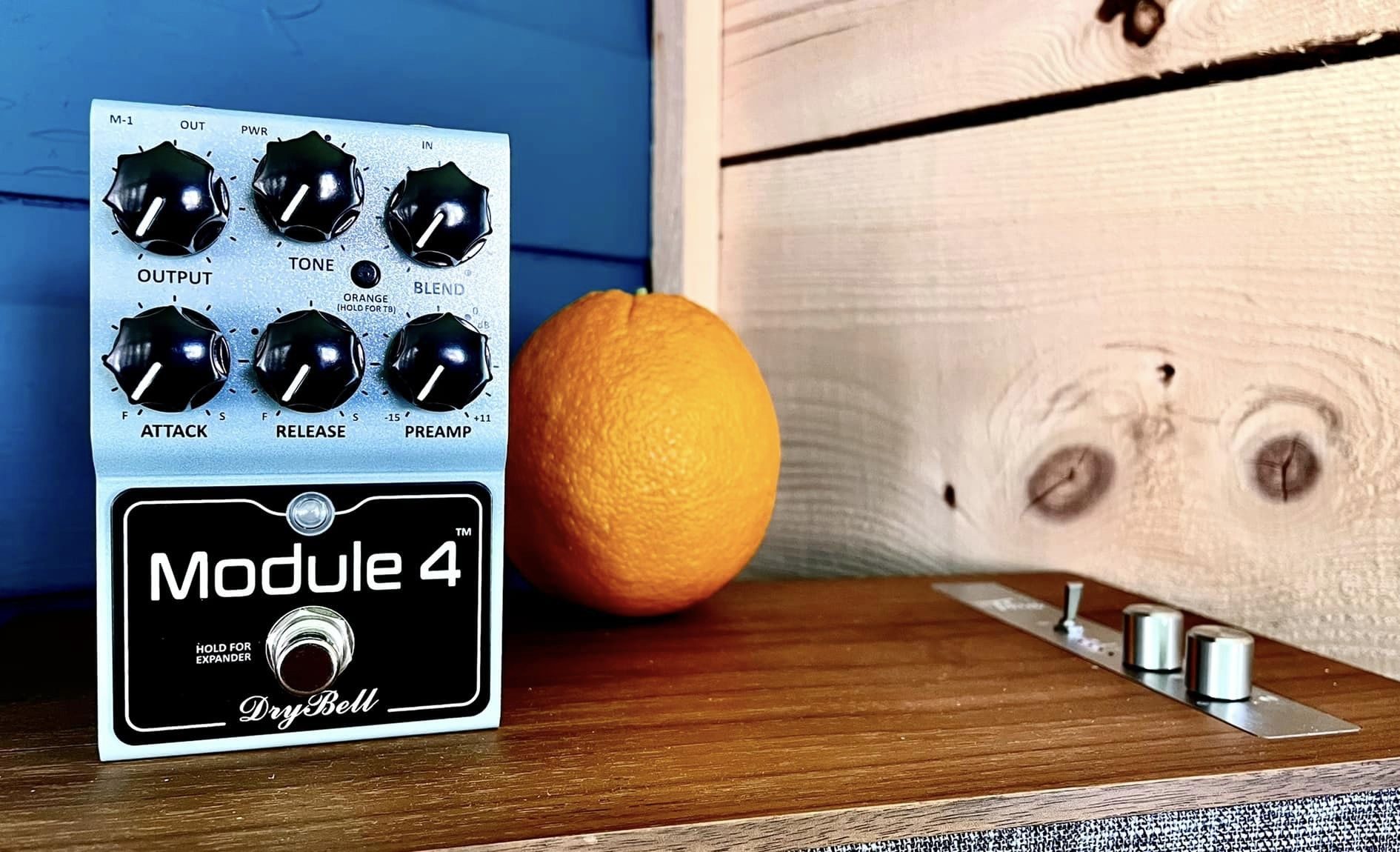 DryBell Module 4 Compressor Pedal Alongside an Orange, photo by Mick Hayes