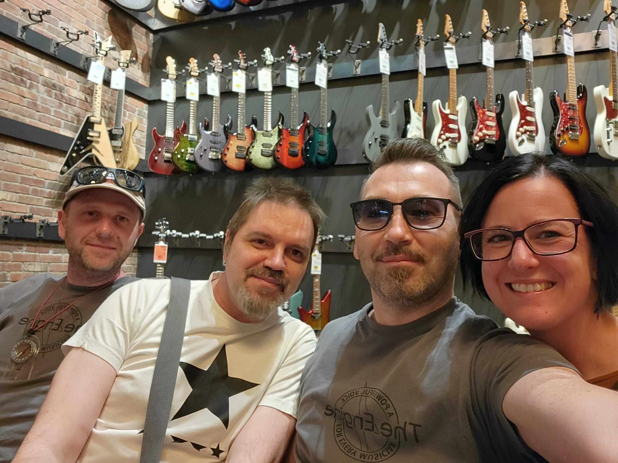 DryBell team members Zvonch, Kruno, Kiki, and Martina in a music store.