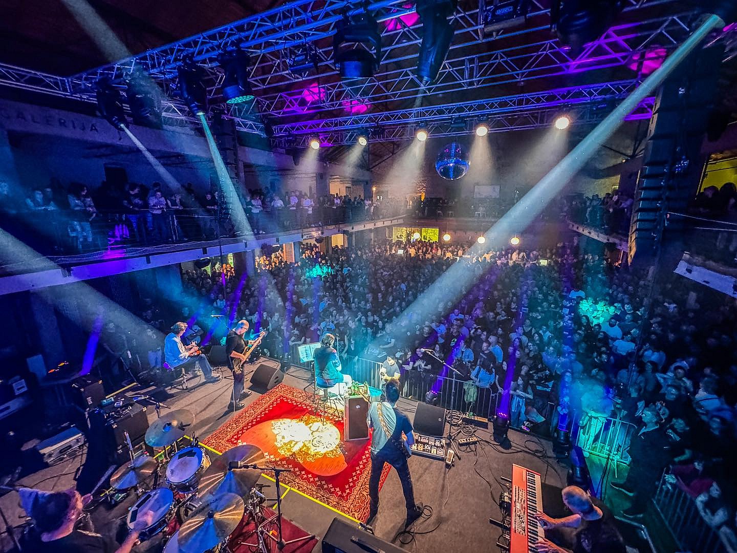 Kruno Domacinovic, a member of the DryBell team, performing on stage with his band 'Majke,' an iconic Croatian rock band.