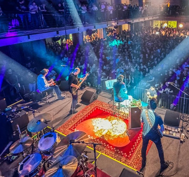 Kruno Domacinovic, a member of the DryBell team, performing on stage with his band 'Majke,' an iconic Croatian rock band.