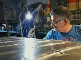 Marijan Suhodolcan working on enclosures for DryBell pedals in Zvonch's home workshop, ensuring a flawless finish.