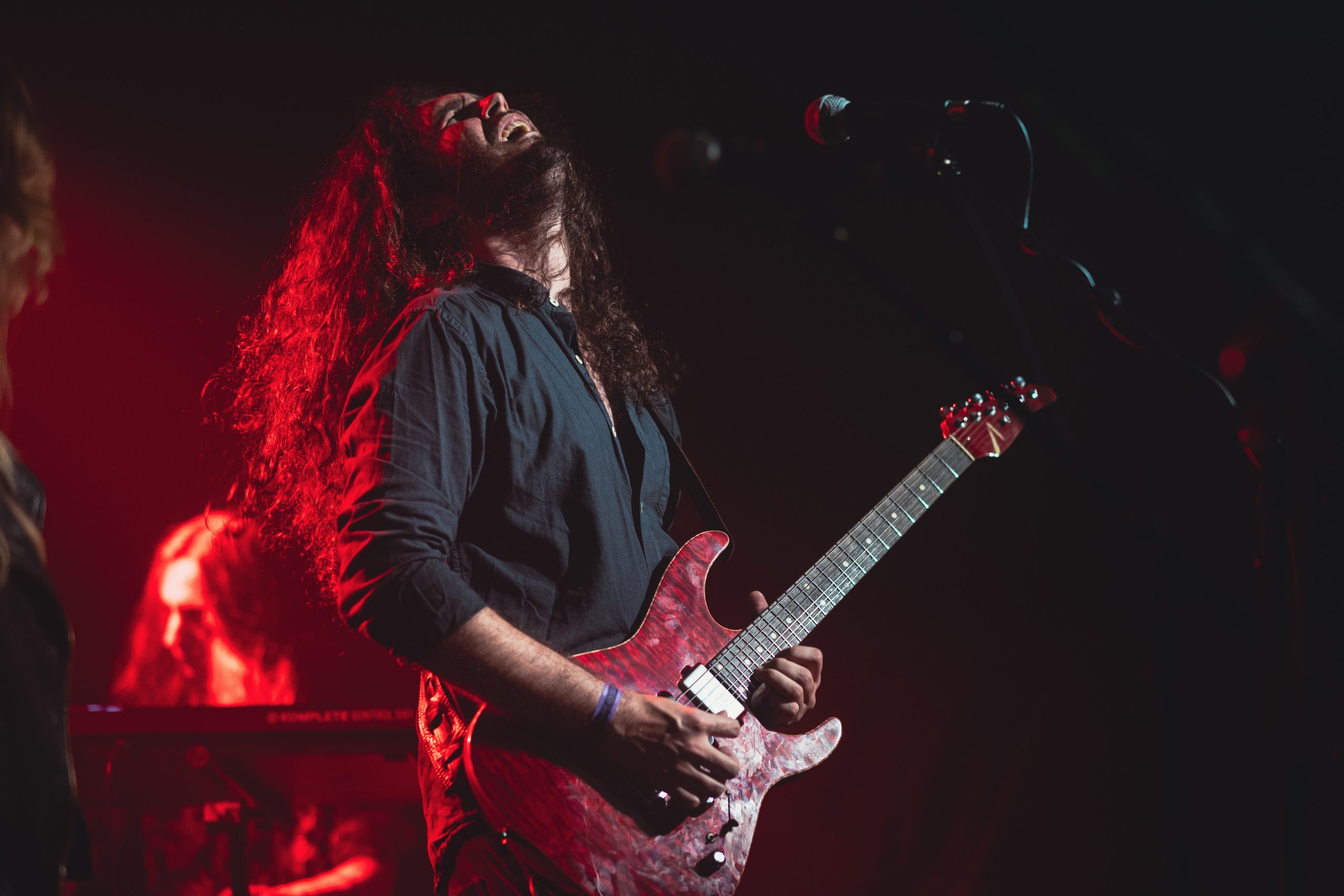 Edgard dos Santos Paiva from Polymorph, psychedelic rock guitarist and DryBell artist playing guitar live at a concert.
