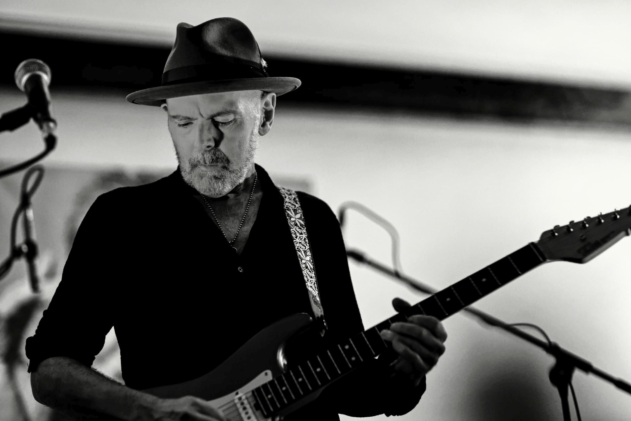 Jeff McErlain, NYC-based guitarist and DryBell artist playing guitar live at a concert.